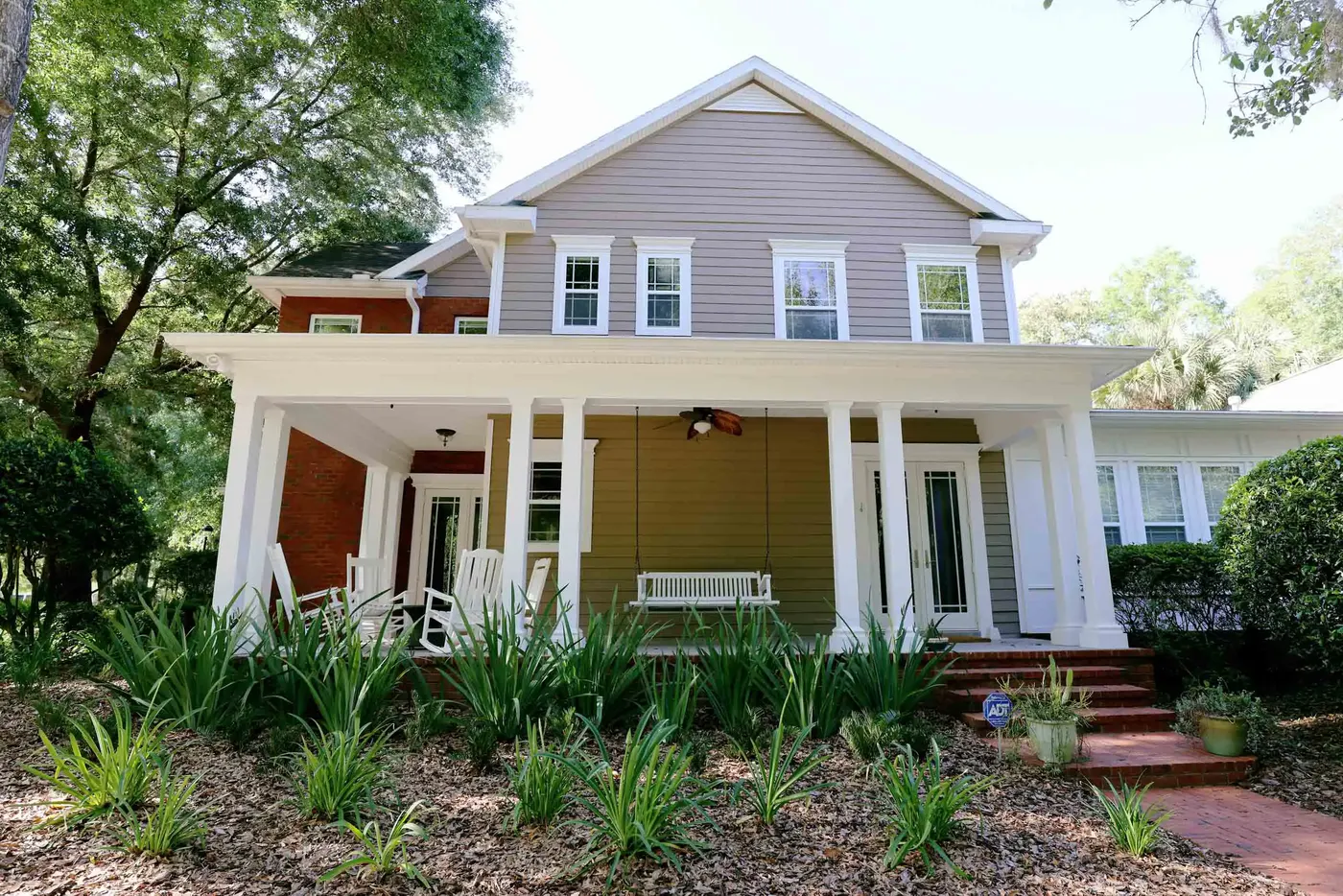 Craftsman home with new mulched foundation beds and walkway
