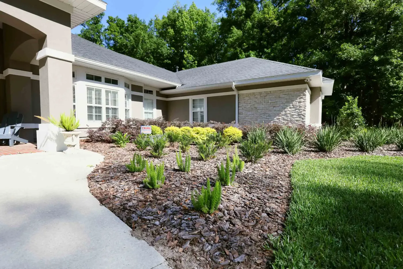 Home with stone accents and new foundation plantings